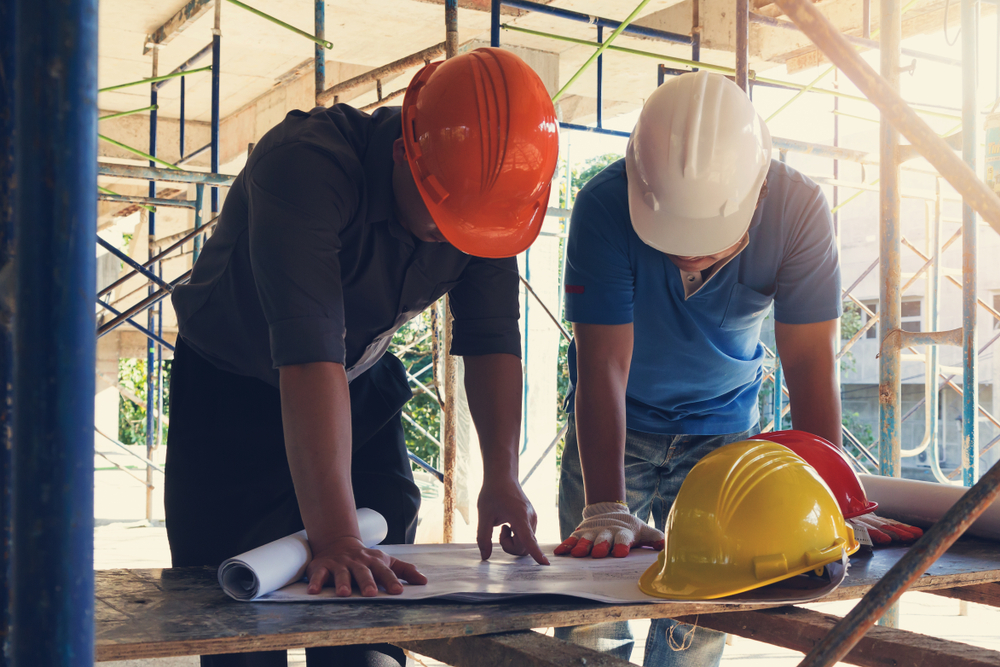 Woman,Signing,Construction,Contract,With,Contractor,To,Build,A,House